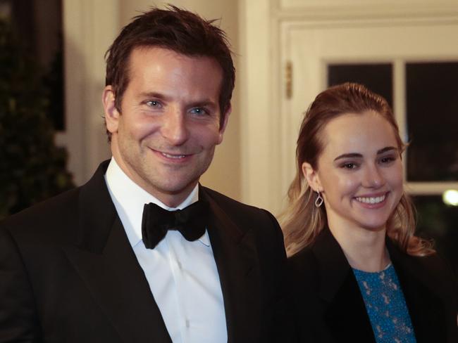 WASHINGTON, DC - FEBRUARY 11: Actor Bradley Cooper, left, and Suki Waterhouse arrive to a state dinner hosted by U.S. President Barack Obama and U.S. first lady Michelle Obama in honor of French President Francois Hollande at the White House on February 11, 2014 in Washington, DC. Obama and Hollande said the U.S. and France are embarking on a new, elevated level of cooperation as they confront global security threats in Syria and Iran, deal with climate change and expand economic cooperation. (Photo by Andrew Harrer-Pool/Getty Images)