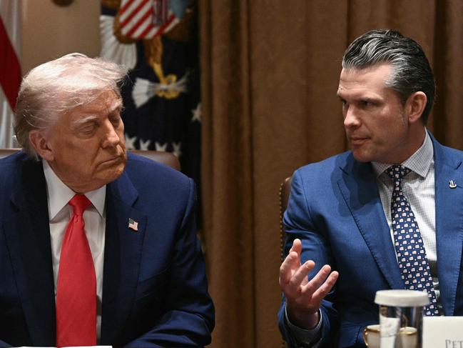 (FILES) (L-R) US President Donald Trump looks on as Secretary of Defense Pete Hegseth speaks during a cabinet meeting in the Cabinet Room of the White House on April 10, 2025, in Washington, DC. US Defense Secretary Pete Hegseth shared information on forthcoming US air strikes on Yemen in a private Signal chat group that included his wife, brother and personal lawyer, the New York Times reported on April 20. AFP was not able to independently verify the Times' report, which detailed what would be the second time Hegseth has been accused of sharing sensitive military information on the commercial messaging app with unauthorized personnel. (Photo by Brendan SMIALOWSKI / AFP)