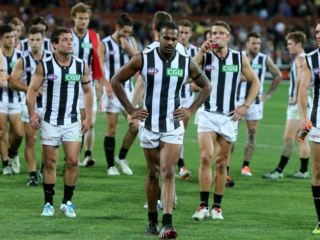 Heritier Lumumba leads Collingwood off the field.