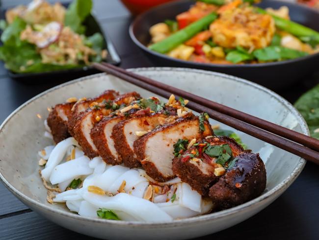 Crumbed pork loin with rice noodles. Picture: Jenifer Jagielski