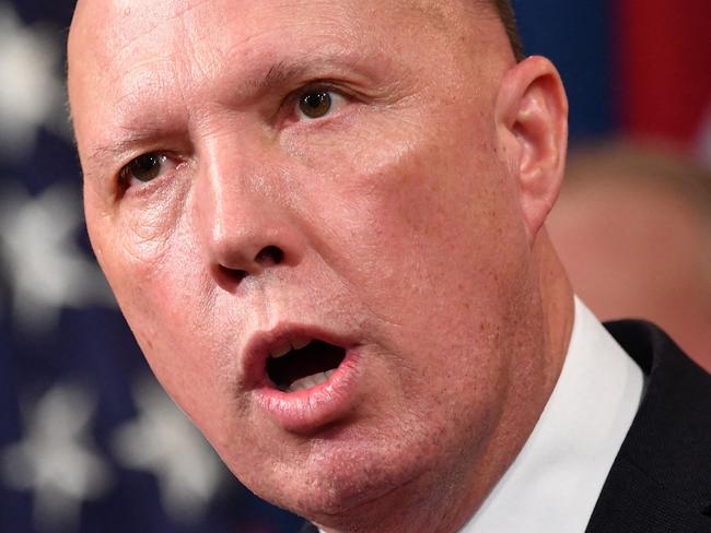 (FILES) A file photo taken on March 5, 2020 shows Australia's then-Home Affairs Minister Peter Dutton during a press conference at the Department of Justice in Washington, DC. - Dutton, who became Australia's new defence minister on March 29, 2021, is a hardline ex-cop who has overseen a controversial refugee policy, riled close ally New Zealand by deporting criminal Kiwis and publicly clashed with the Chinese government. (Photo by Mandel NGAN / AFP)