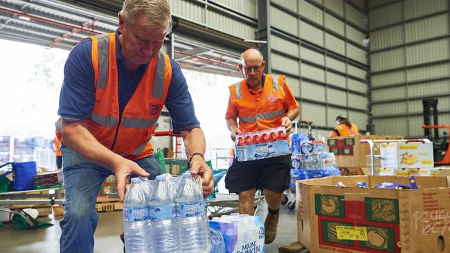 Volunteers organise donations at a distribution centre for bushfire-hit areas near Sydney. Picture: Getty Images