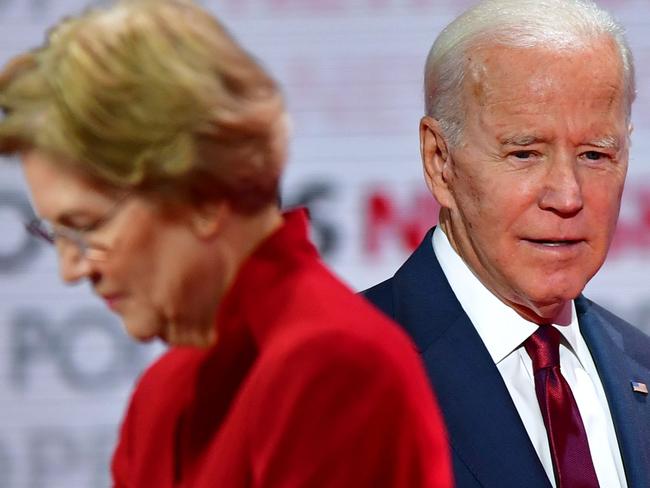 (FILES) In this file photo Democratic presidential hopefuls Massachusetts Senator Elizabeth Warren (L) and former Vice President Joe Biden take part in the sixth Democratic primary debate of the 2020 presidential campaign season co-hosted by PBS NewsHour & Politico at Loyola Marymount University in Los Angeles, California on December 19, 2019. - Senator Elizabeth Warren officially endorsed former Vice President Joe Biden, media sources reported on April 15, 2020. The former 2020 Democratic presidential candidate tweeted out her endorsement with a video message, noting the empathy Biden extends to struggling Americans. (Photo by Frederic J. Brown / AFP)