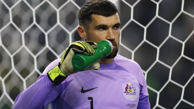 ARLINGTON, TEXAS - SEPTEMBER 9: Mat Ryan #1 of Australia hydrates during a pause in the action against Mexico during the second half of a 2023 International Friendly match at AT&T Stadium on September 9, 2023 in Arlington, Texas. (Photo by Ron Jenkins/Getty Images)