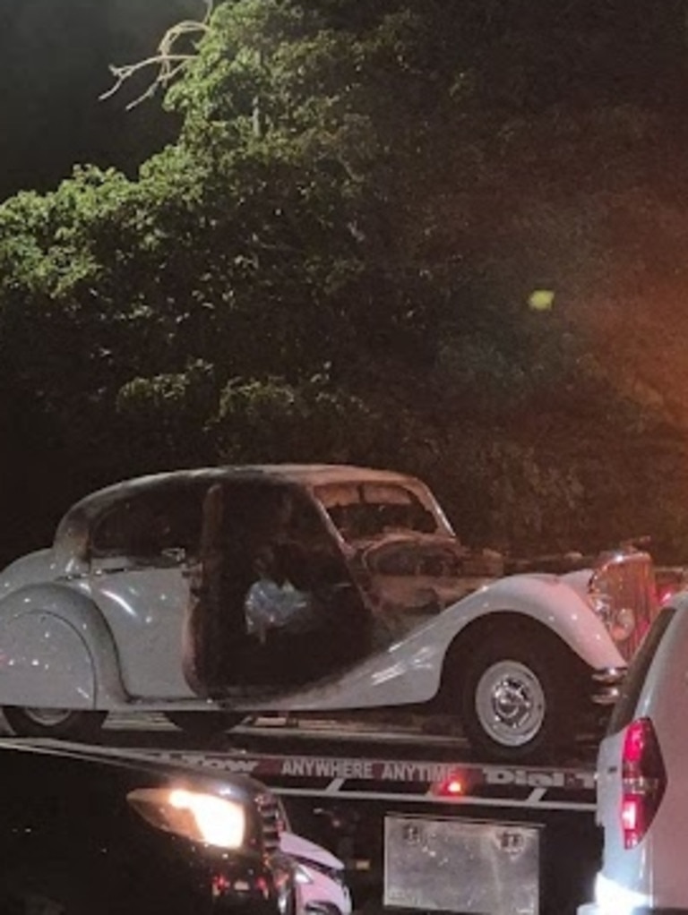 In a devastating sight for car lovers, the damaged Jaguar is towed from the scene. Picture: Jessica Ball