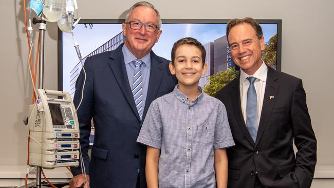 NSW Health Minister Brad Hazzard and his Federal counterpart Greg Hunt with cancer patient Jack at the announcement of $680m funding for cancer treatment at Sydney Children’s Hospital.