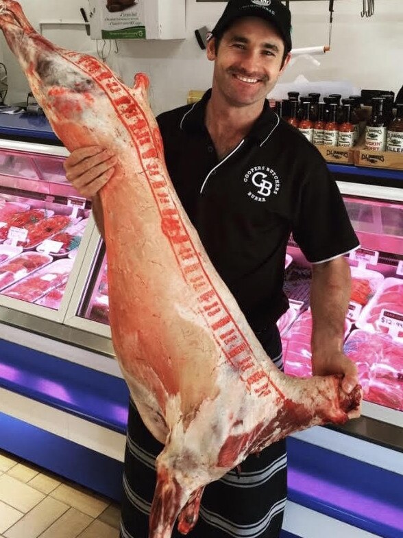 Coopers Butchers owner Casey Cooper holds a whole lamb. The Burra business was voted Barossa, Clare and Gawler’s best butcher in our poll. Picture: Supplied