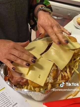 The piece de resistance was a layer of sliced cheese. Picture: TikTok