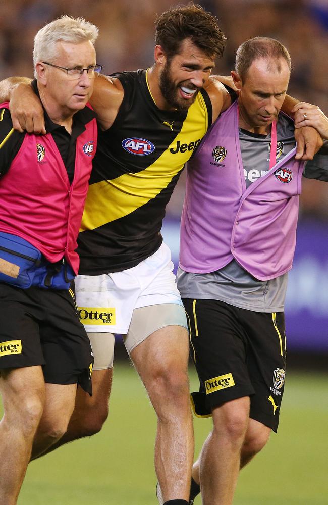 Alex Rance leaves the field after injuring his ACL earlier in the season.