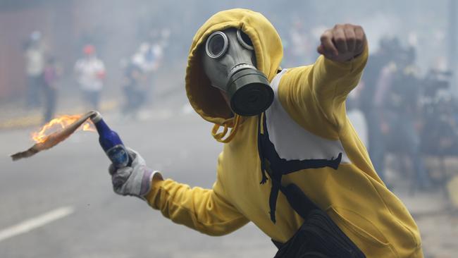 Venezuelans are taking to the streets as an intensifying protest movement enters its second month. Picture: Ariana Cubillos/AP