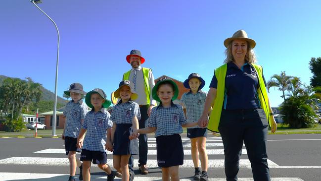 Our Lady Help of Christians students cross the road safely outside of school. (L to R) Ethan Cook, 6, Hugh Fletcher, 5, Tayla Warren, 6, OLHC school principal Brendon Napier, Millie Armstrong, 6, Ruby Bita, 9, OLHC Travel Smart coordinator Jill Watson. Picture: Elodie Jakes