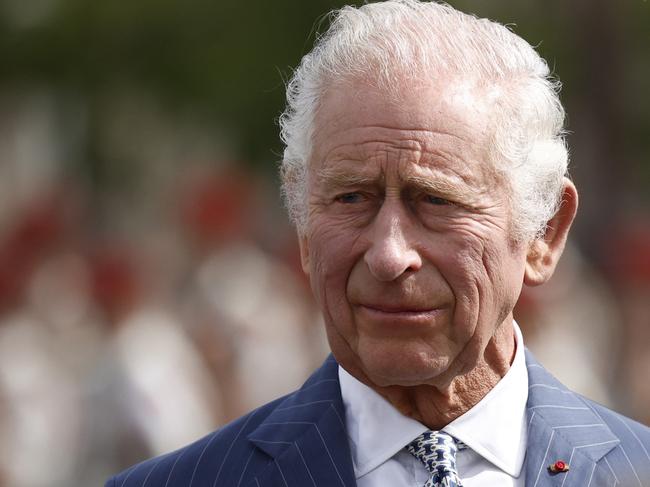 (FILES) Britain's King Charles III looks on during an official welcoming ceremony at the Arc de Triomphe in Paris on September 20, 2023, on the first day of a state visit to France. Britain's King Charles III has been diagnosed with a "form of cancer" according to a statement released by Buckingham Palace on February 5, 2024. (Photo by Yoan VALAT / POOL / AFP)