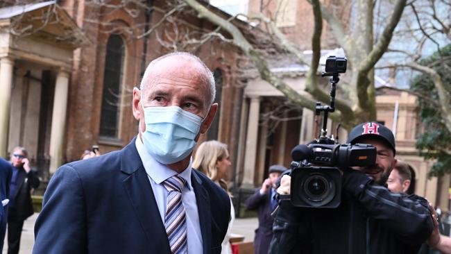 Chris Dawson (left) arrives at the Supreme Court.