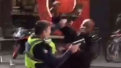 Hassan Khalif Shire Ali tries to stab an officer before he was fatally wounded in Friday’s attack on Bourke Street.