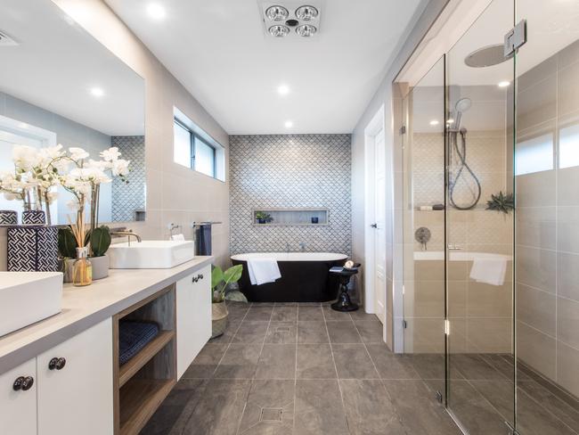 The family bathroom with separate bath and shower, and double vanity.