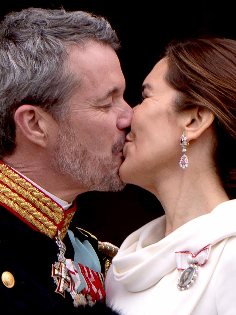 Frederik planted a kiss on his wife after the ascension was finalised. Picture: Bo Amstrup/Ritzau Scanpix/AFP