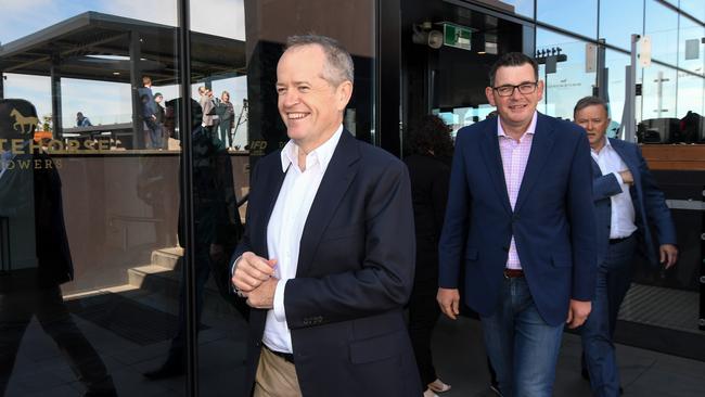 Federal Opposition Leader Bill Shorten and Victorian Premier Daniel Andrews arrive for a press conference on the rooftop of the Chen Hotel in Box Hill , Melbourne, Sunday, October 14, 2018. Bill Shorten is backing the Victorian Labor government's promise for a new suburban rail loop, pledging to tip in $300 million. (AAP Image/Penny Stephens) NO ARCHIVING