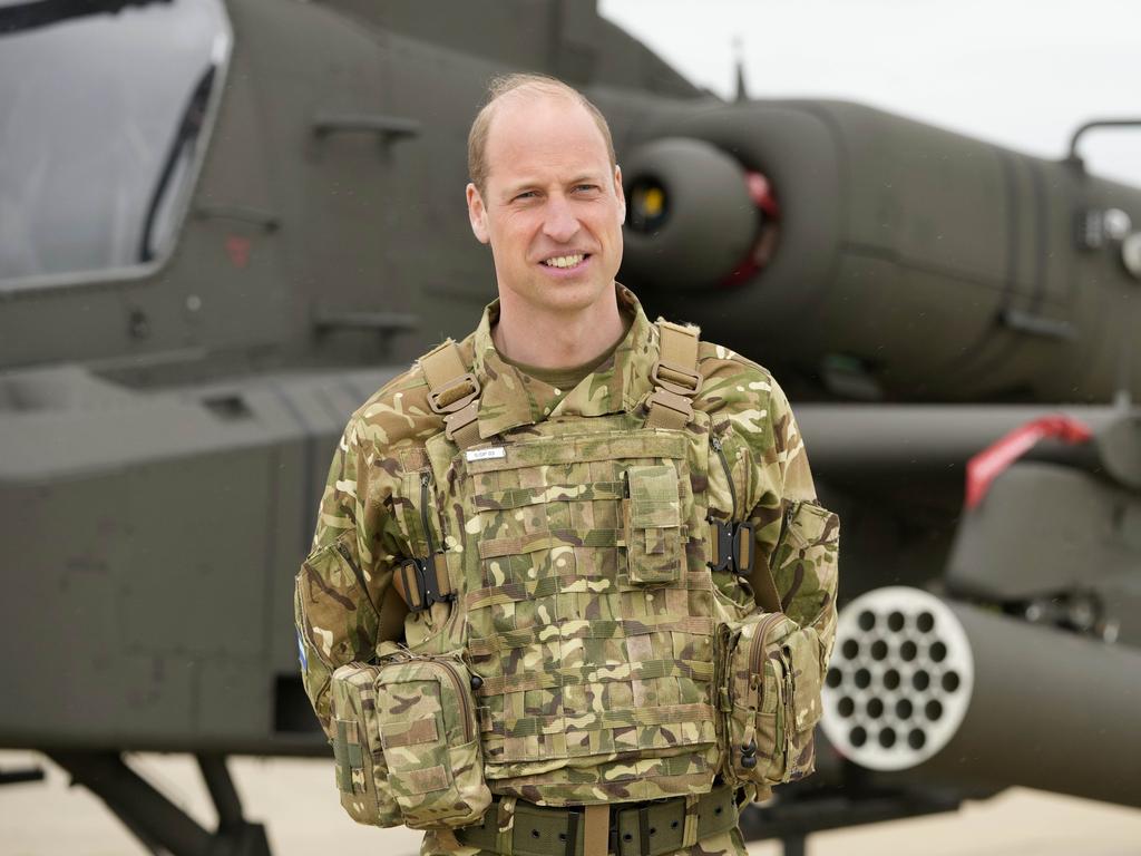 Prince William stands in front of an Apache helicopter at the Army Aviation Centre in Middle Wallop. Picture: Getty Images