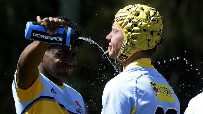 Samuela Sorovi and Douglas Manning from U15 Waugh cool off in a drinks break at the next Gen Cup. Picture: John Appleyard