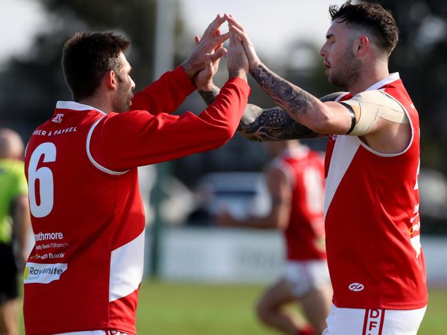 Lachlan Ronaldson and Adam Winter celebrate a goal on Saturday. Picture: Mark Dadswell