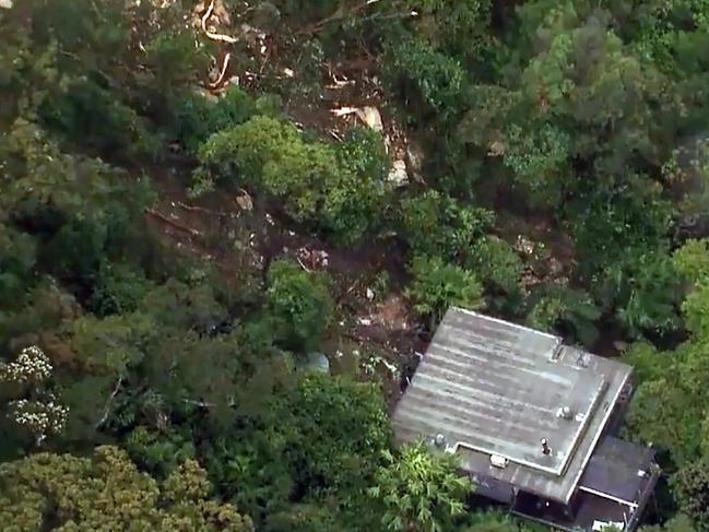 Wild wet and windy storm weather has triggered a landslide on Sydney's far north shore as the Australian eastern seaboard continues to get lashed by heavy rain and wind. Picture: 9News