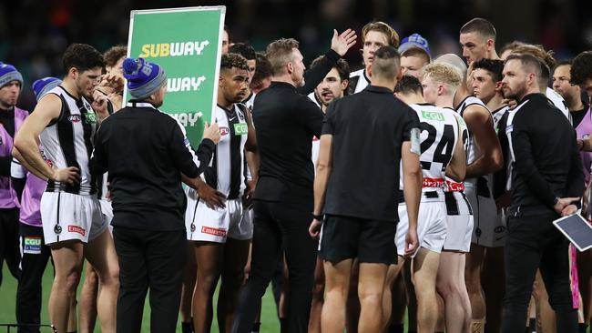 Buckley gives his final address to his players at three-quarter-time against Melbourne. Picture: Matt King/Getty Images