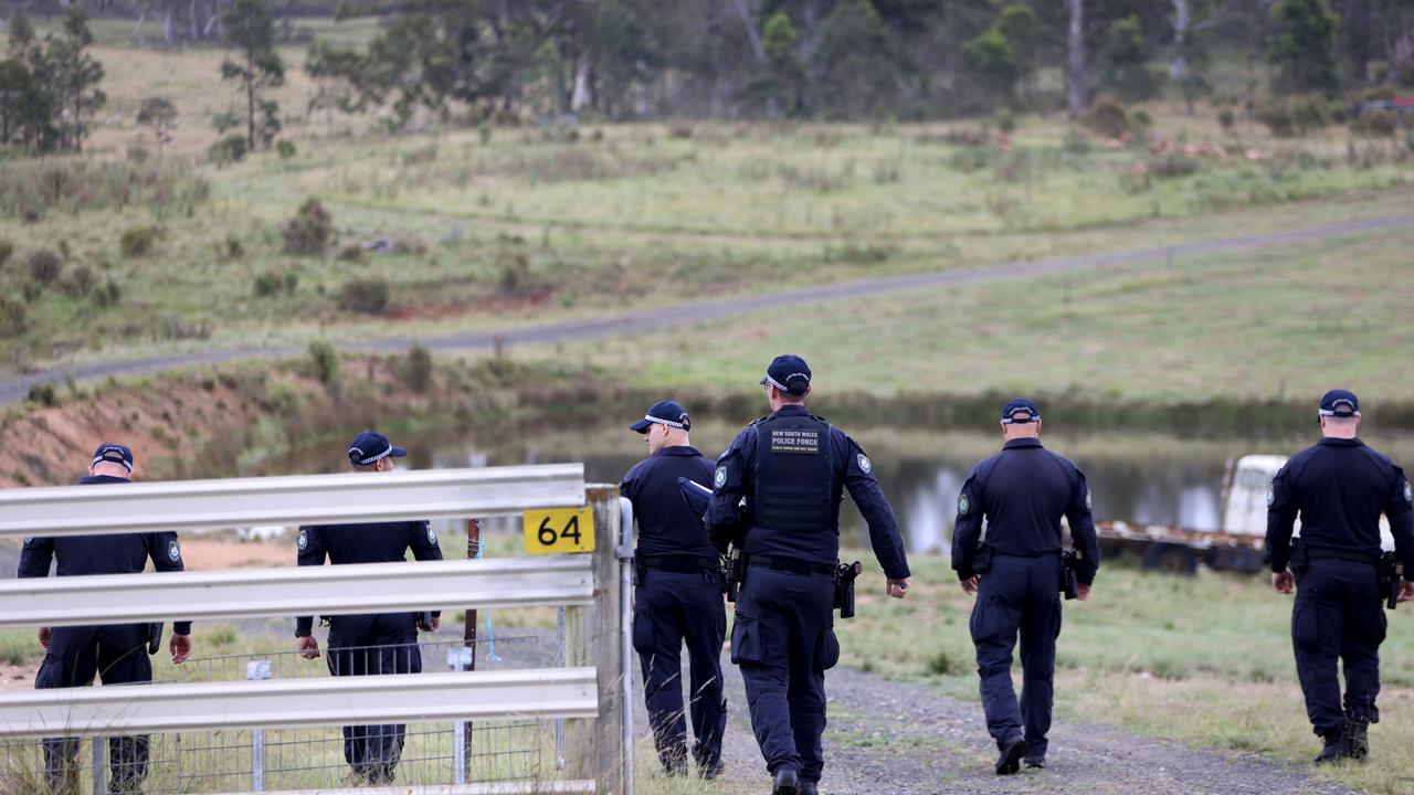 Police pictured doing a line search at a property off Hazelton Road in Bungonia. A second property in the area has now been declared a crime scene, and human remains discovered. Picture: NCA NewsWire / Damian Shaw