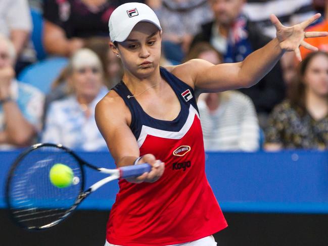 Ashleigh Barty of Australia hits a return against Angelique Kerber of Germany during their women's singles match on day seven of the Hopman Cup. Picture: AFP