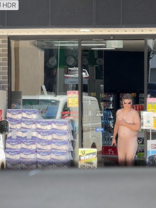 A naked man pays for his fuel at a busy petrol station in Sydney’s east.