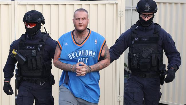 Raptor Squad officers take Trent Jeske into custody. Picture: Rohan Kelly