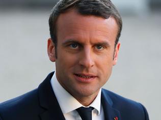 French President Emmanuel Macron looks on as he delivers a joint press briefing with Italian Prime Minister (unseen) during their meeting at the Elysee Palace in Paris, on May 21, 2017.  French President Emmanuel Macron met Italian Prime Minister Paolo Gentiloni in Paris ahead of next week's G7 summit in Sicily. / AFP PHOTO / Thomas SAMSON