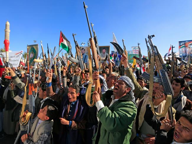 Demonstrators shout slogans and raise their assault rifles during a rally to denounce Israel and in solidarity with Palestinians in the Huthi-controlled capital Sanaa, on January 17, 2025. Picture: AFP