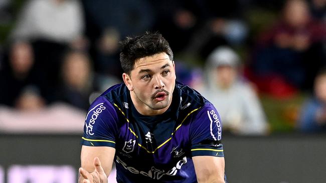 SUNSHINE COAST, AUSTRALIA – JUNE 19: Brandon Smith of the Storm passes the ball during the round 15 NRL match between the Melbourne Storm and the Wests Tigers at Sunshine Coast Stadium, on June 19, 2021, in Sunshine Coast, Australia. (Photo by Bradley Kanaris/Getty Images)