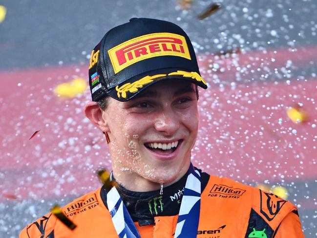 BAKU, AZERBAIJAN - SEPTEMBER 15: Race winner Oscar Piastri of Australia and McLaren celebrates on the podium during the F1 Grand Prix of Azerbaijan at Baku City Circuit on September 15, 2024 in Baku, Azerbaijan. (Photo by Dan Mullan/Getty Images)