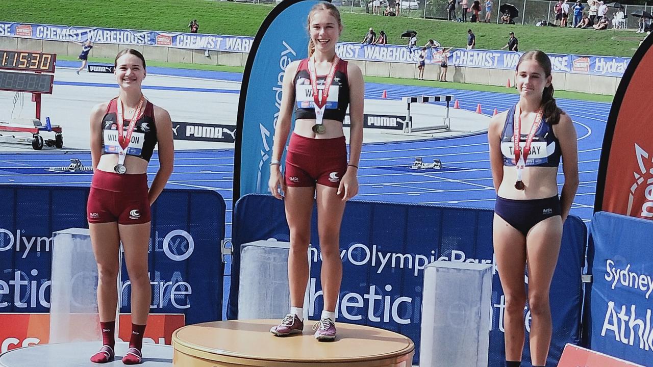 Xanthee Watts celebrates her under-14 400m gold medal win at the Australian Track and Fields Championships.