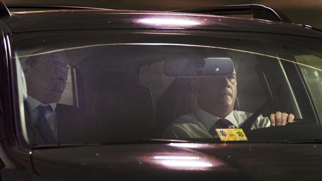 Paul Manafort, left, leaves his home in Alexandria, Virginia last night. Picture: AP