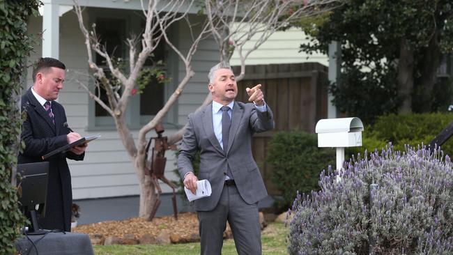 Hodges, Geelong West auctioneer Marcus Falconer calls bids a Cradock St, North Geelong auction. Buyers were keen on the location, minutes from Pakington St, Geelong West. Picture: Mike Dugdale