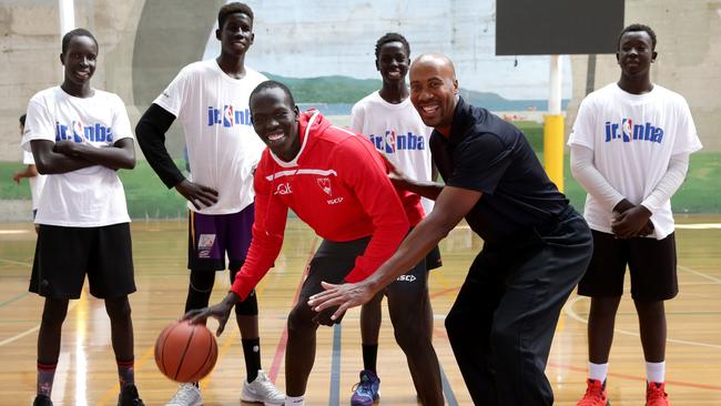 Retired San Antonio Spurs great Bruce Bowen with Aliir Aliir during a charity event for underprivileged children at King George V Recreation Centre. Picture: Gregg Porteous