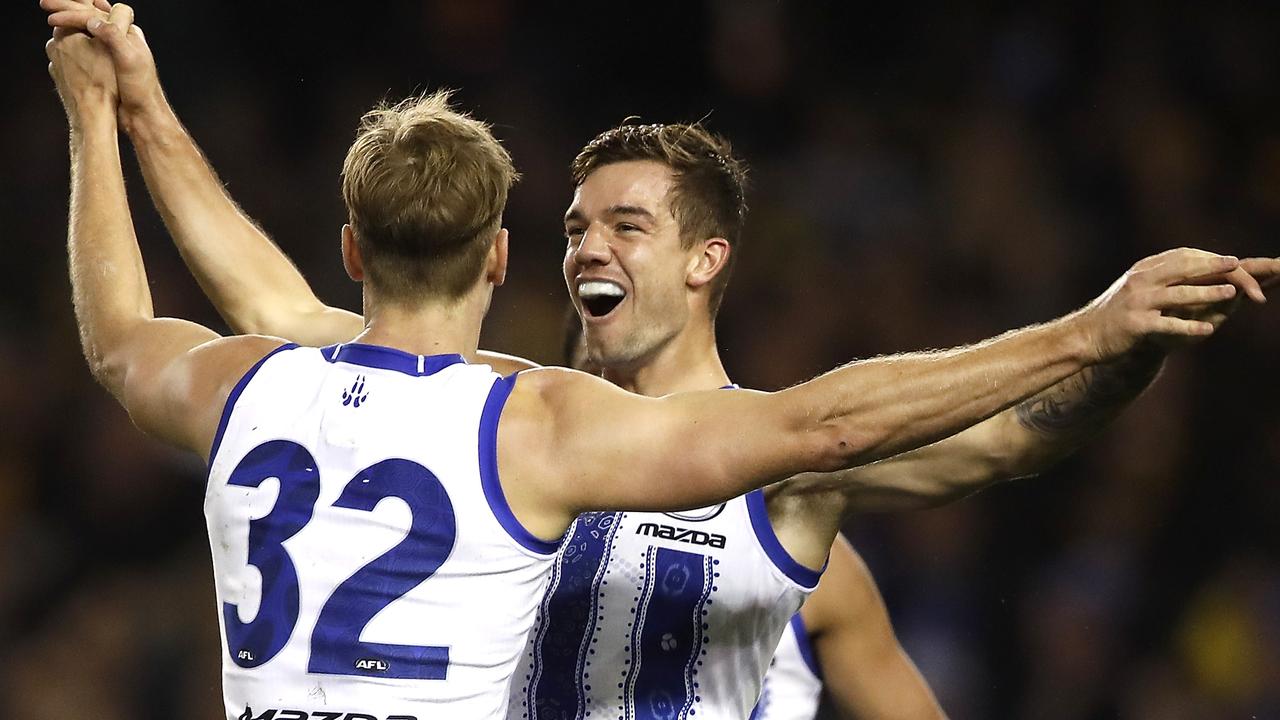 Jy Simpkin (right) celebrates a Kangas goal with Mason Wood. Pic: AFL Photos