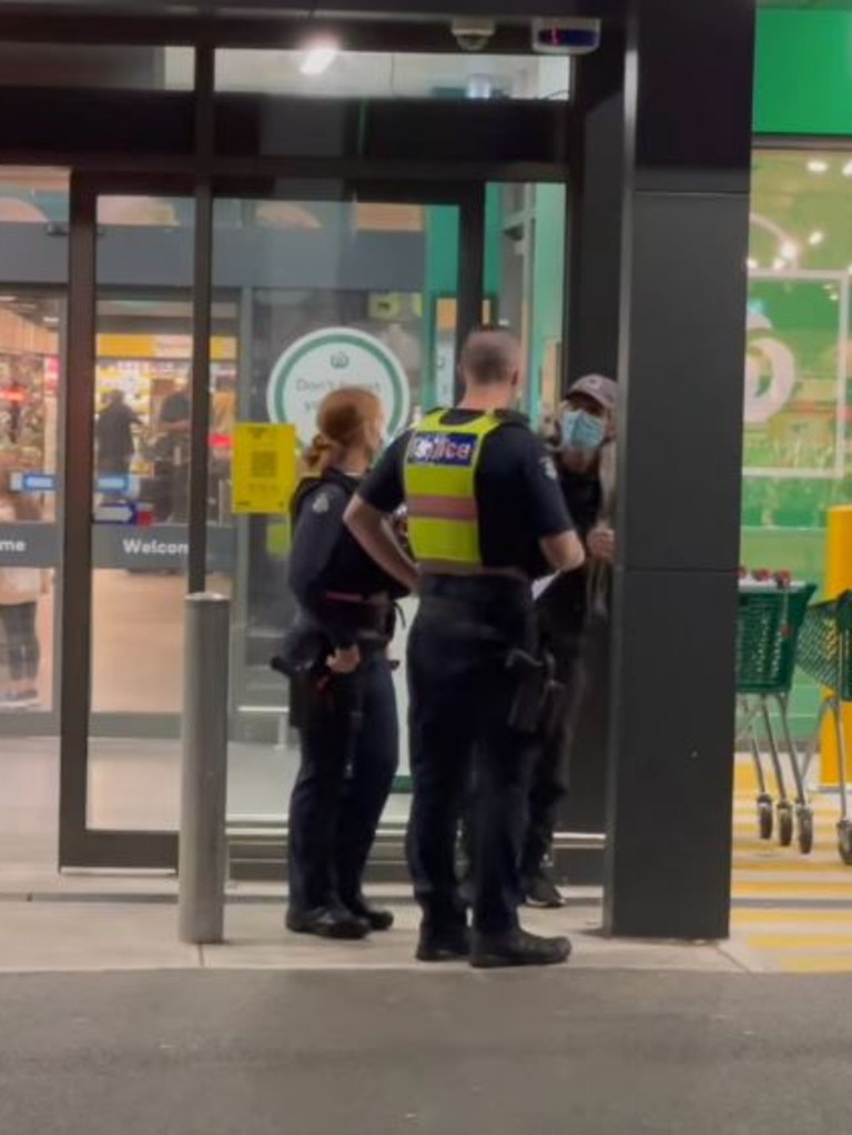 The two Melbourne officers were seen talking to a man outside a local Woolworths. Picture: Adele Barbaro/Facebook