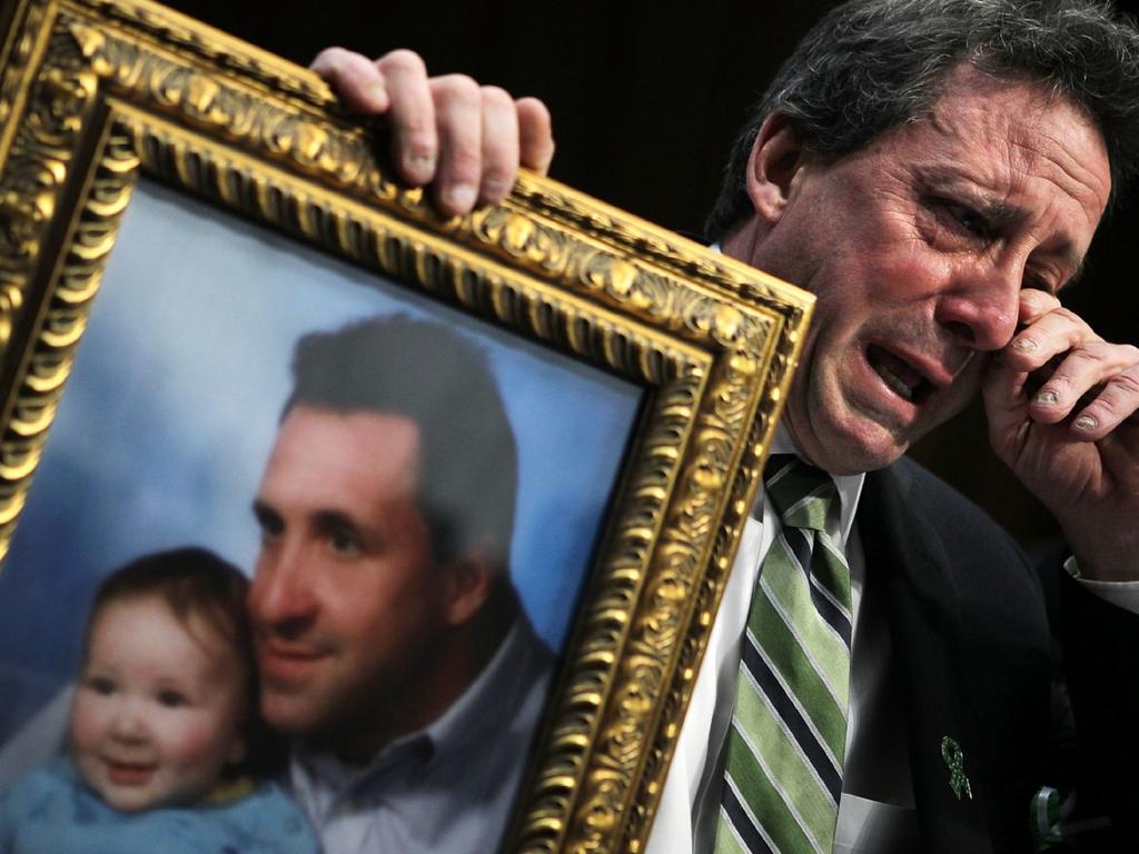 Neil Heslin, father of six-year-old Sandy Hook shooting victim Jesse Lewis, wipes tears as he testifies during a hearing before the Senate Judiciary Committee February 27, 2013. Pic: AFP