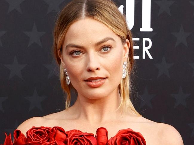 (FILES) Australian actress Margot Robbie arrives for the 29th Annual Critics Choice Awards at the Barker Hangar in Santa Monica, California on January 14, 2024. Nominations for this year's Oscars will be unveiled on January 23, 2024, with the  "Barbenheimer" juggernaut expected to roll on to the climax of Hollywood's awards season with multiple chances at glory. After a combined $2.4 billion global box office take, "Barbie" and "Oppenheimer" -- two films linked only by their simultaneous release last July -- are seen as locks for a suite of nods for the 96th Academy Awards, which take place on March 10. (Photo by Michael TRAN / AFP)