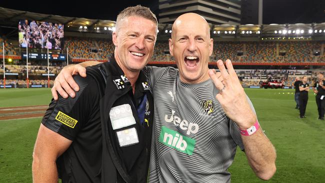 Kleynjans with Richmond Tigers coach Damien Hardwick after the 2020 AFL Grand Final. Picture: Michael Klein