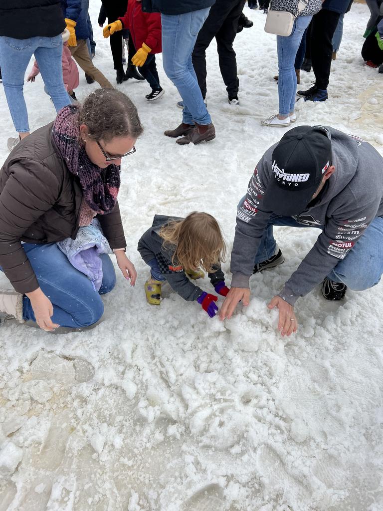 Melinda (L) Aria and Luke (L) building frosty the snowman at Snowflakes in Stanthorpe on Saturday, July 1 2023.