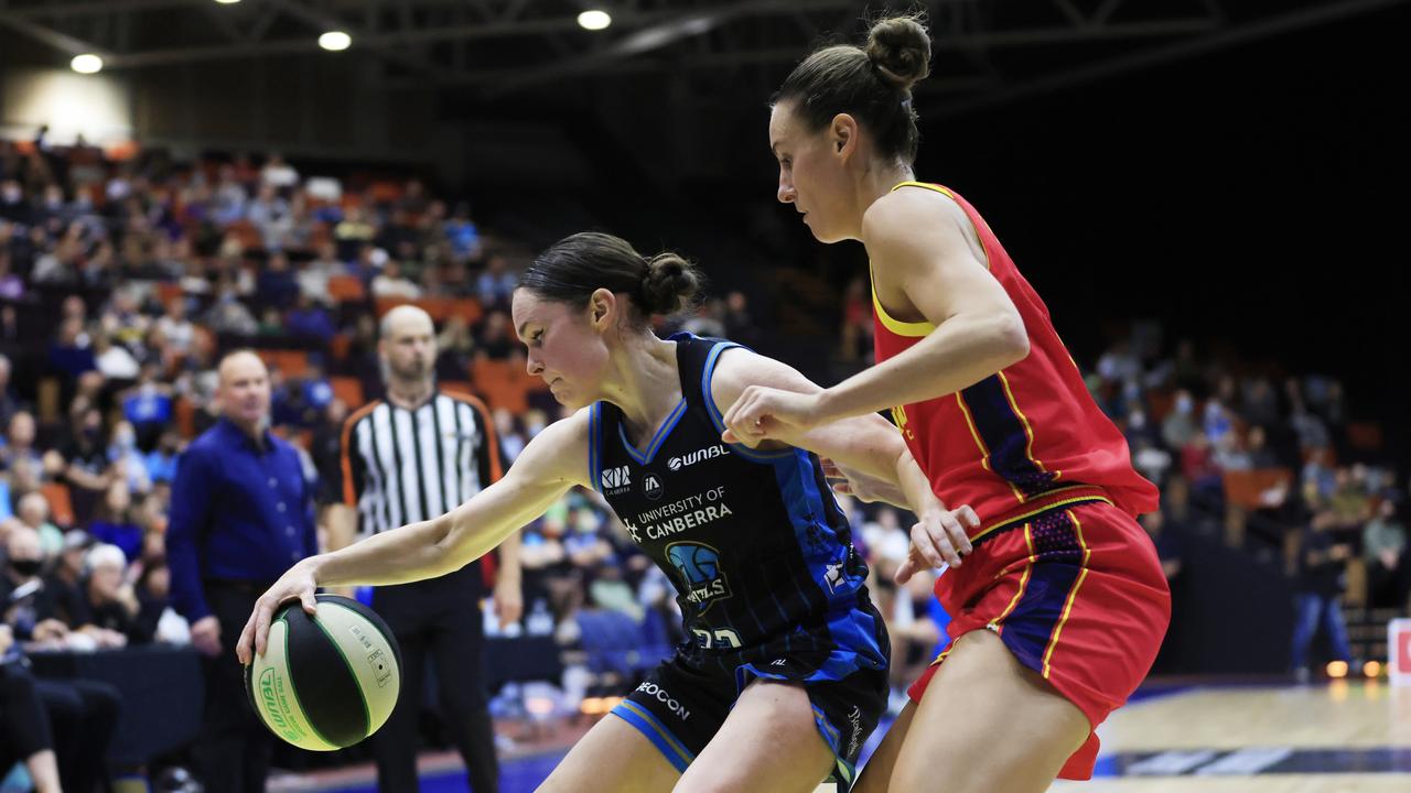Kelly Wilson of the Capitals drives to the basket against Adelaide Lightning last month.