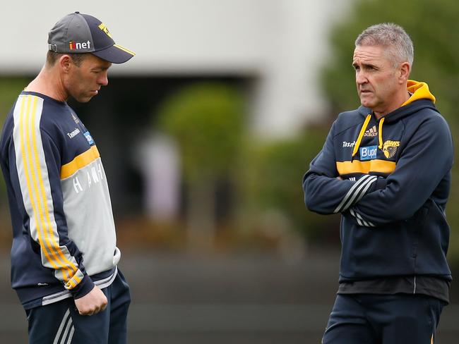 MELBOURNE, AUSTRALIA - SEPTEMBER 17: Alastair Clarkson, Senior Coach of the Hawks (left) and Chris Fagan, Football Manager of the Hawks share a discussion during the Hawthorn Hawks training session at the Ricoh Centre, Melbourne on September 17, 2015. (Photo: Michael Willson/AFL Media)