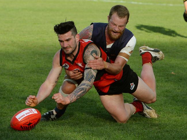 Nathan Rayment is brought to ground by Diggers Rest co-captain John Ryan. Picture: Carmelo Bazzano.