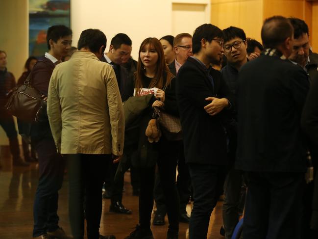 Owners and tenants at the Mascot Towers building queue at the Holiday Inn Sydney Airport ahead of a meeting. Picture: Britta Campion / The Australian