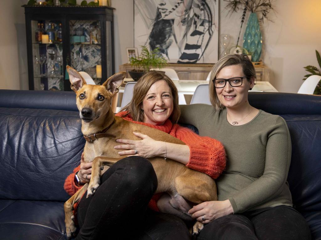 Chanelle Harman (right) and her wife Natalie Todeschini, and their three-year-old Whippet/Kelpie/Jack Russell cross. Albus. Picture: Wayne Taylor