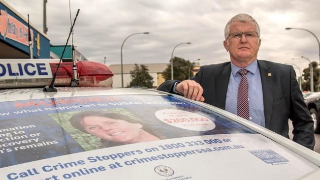 Detective Superintendent Des Bray with one of the posters appealing for information about Susan Goodwin’s disappearance. Picture: Ivon Perrin